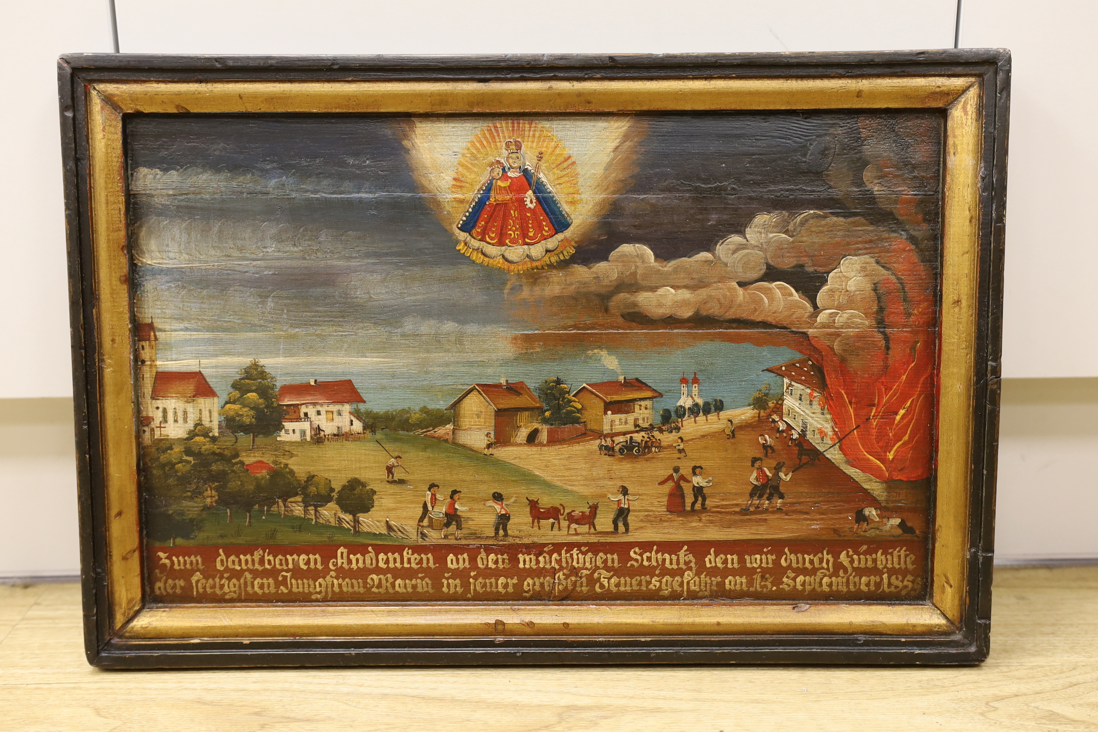 19th century German School, oil on board, Folklore scene with burning building and inscription, dated 1855, 47 x 29cm